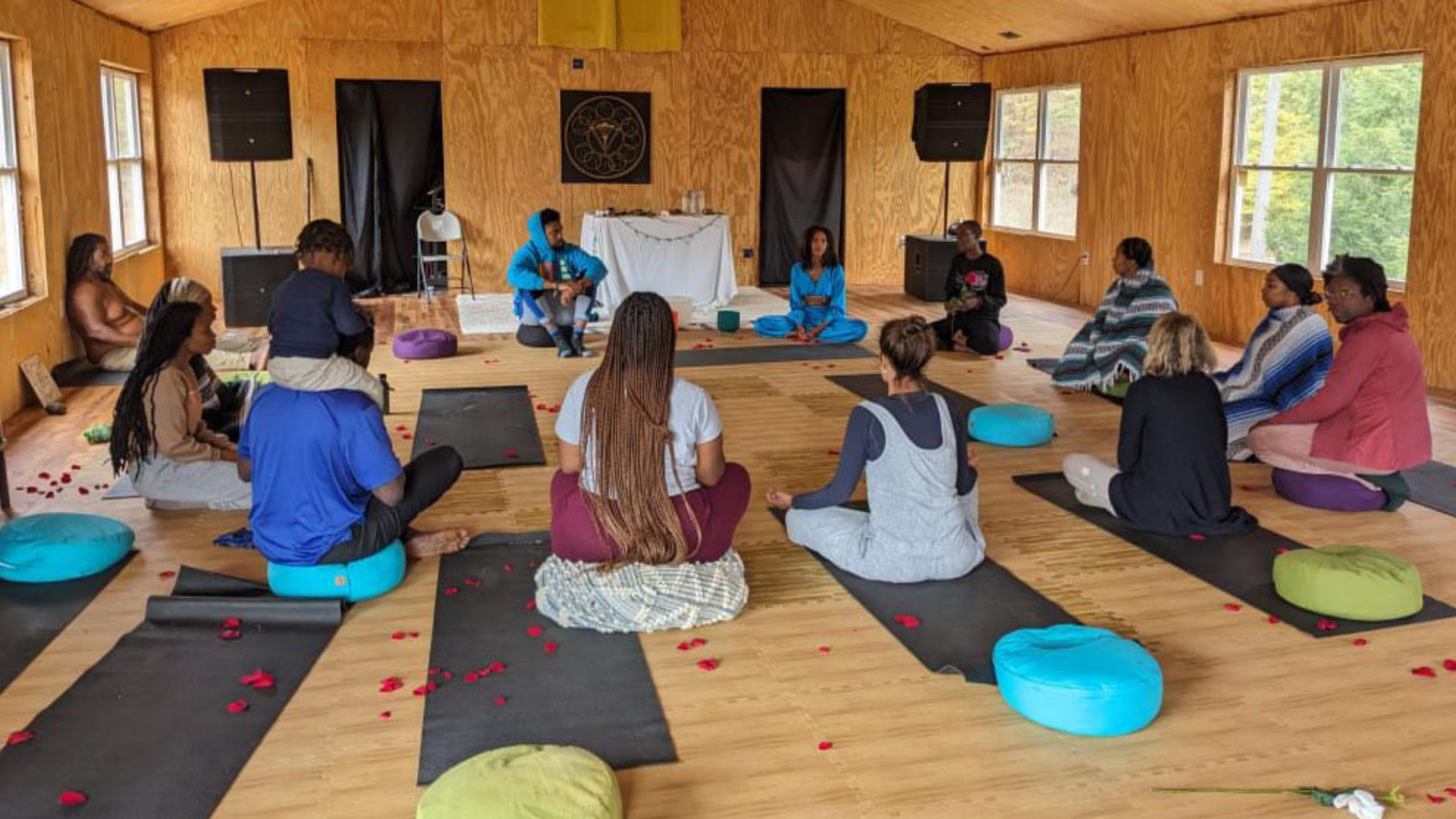 The God’s Rose community seated together in a circle